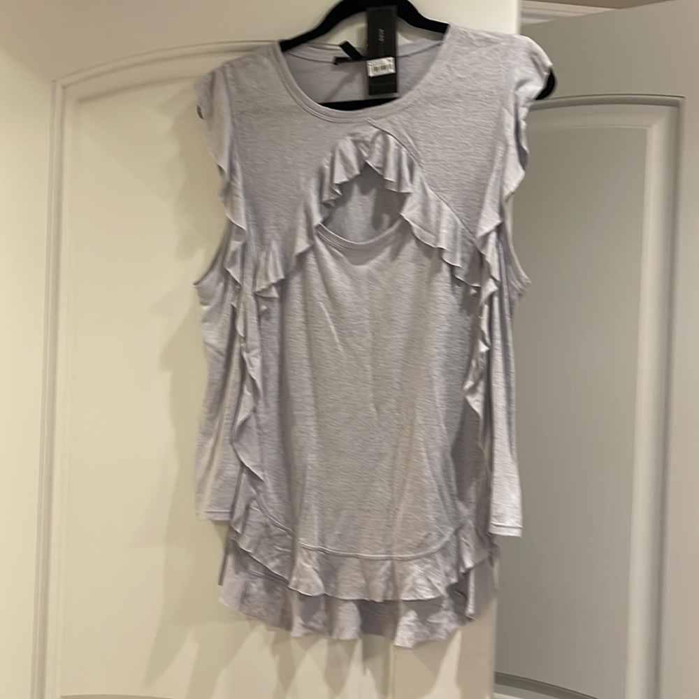 BCBG top size large the color is  pearl blue brand new tags still on never worn